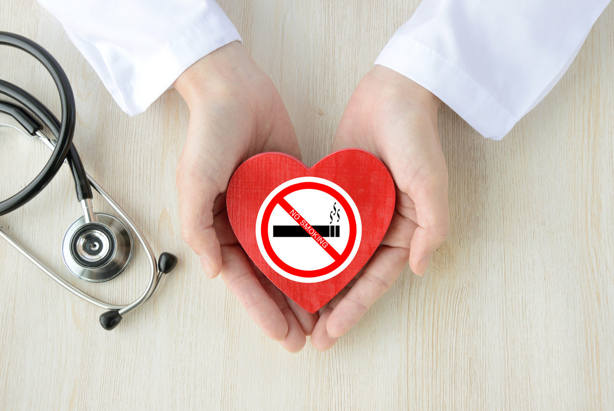 Doctor having heart object with no smoking sticker