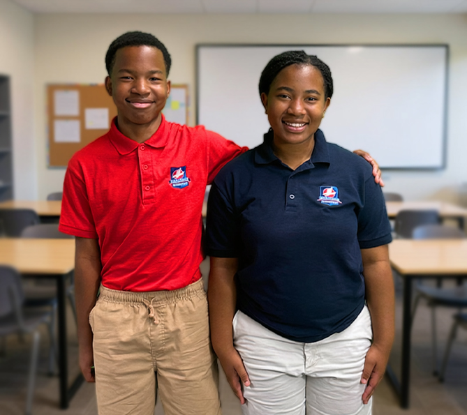 Student raising hand in classroom